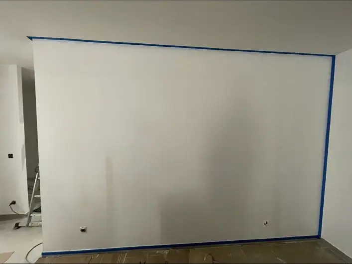 Mur avant enduit décoratif effet sable